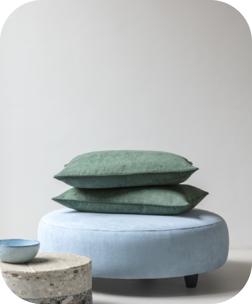 Pillows on fabric ottoman